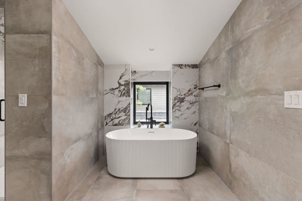 2707 Stacy Lane, Unit 1 Austin, TX 78704 - Photo 33 of 40 a white bath tub sitting in a bathroom