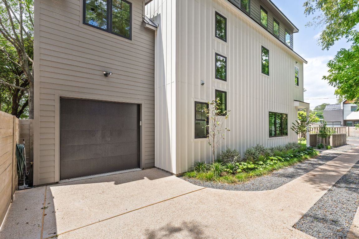 2707 Stacy Lane, Unit 1 Austin, TX 78704 - Photo 35 of 40 a front view of a house with garden