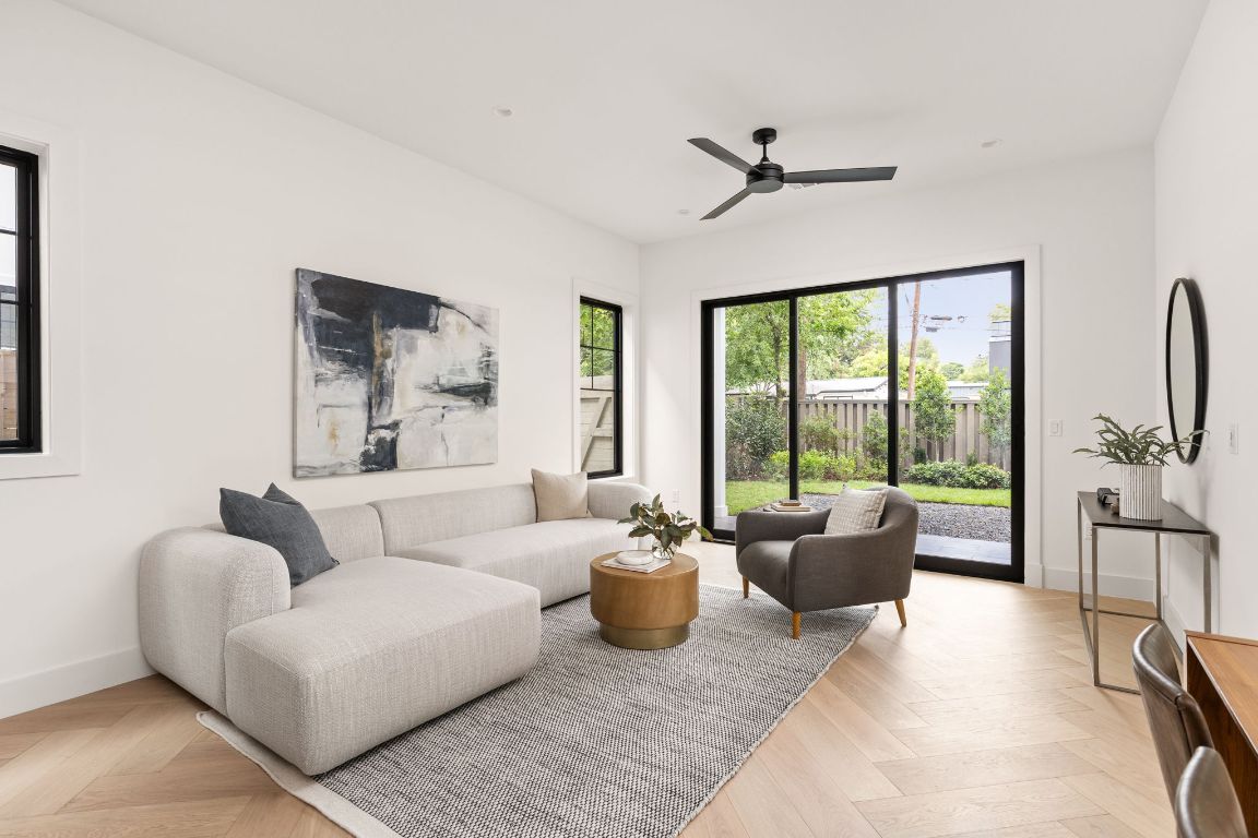 2707 Stacy Lane, Unit 1 Austin, TX 78704 - Photo 6 of 40 a living room with furniture and a large window