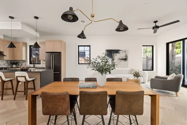 a kitchen with kitchen island a large counter top space appliances and cabinets