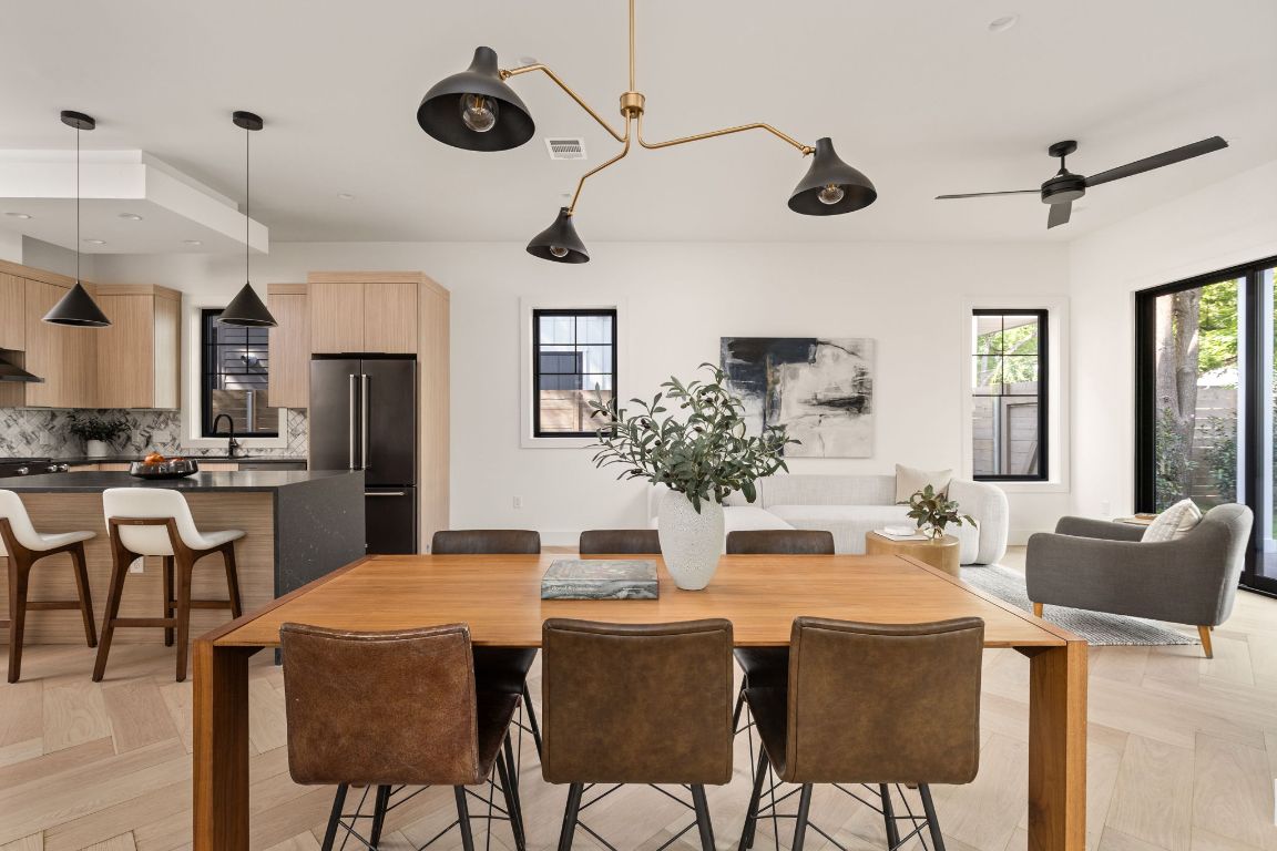 2707 Stacy Lane, Unit 1 Austin, TX 78704 - Photo 10 of 40 a dining room with stainless steel appliances kitchen island granite countertop furniture and a kitchen view