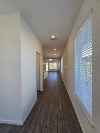 a view of gallery with wooden floor