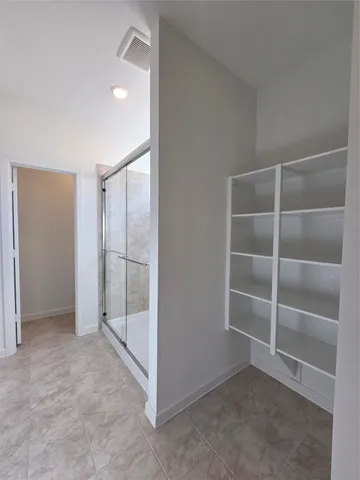 an empty room with a empty space and empty shelves