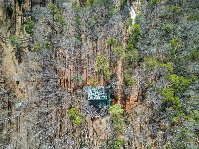 a view of a town with mountains in the background