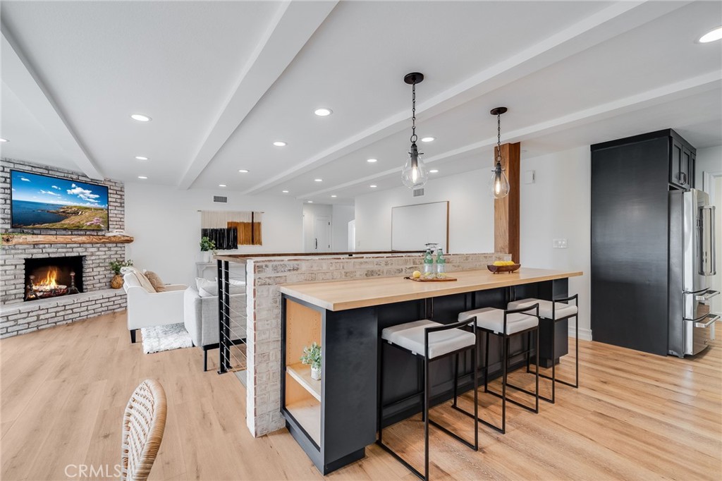 26822 Calle Real Dana Point, CA 92624 - Photo 11 of 41 a large kitchen with a table and chairs