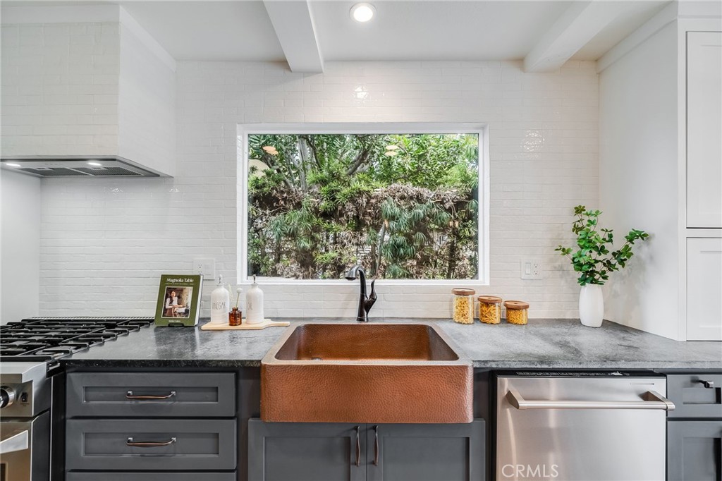 26822 Calle Real Dana Point, CA 92624 - Photo 13 of 41 a kitchen with a sink a counter and cabinets
