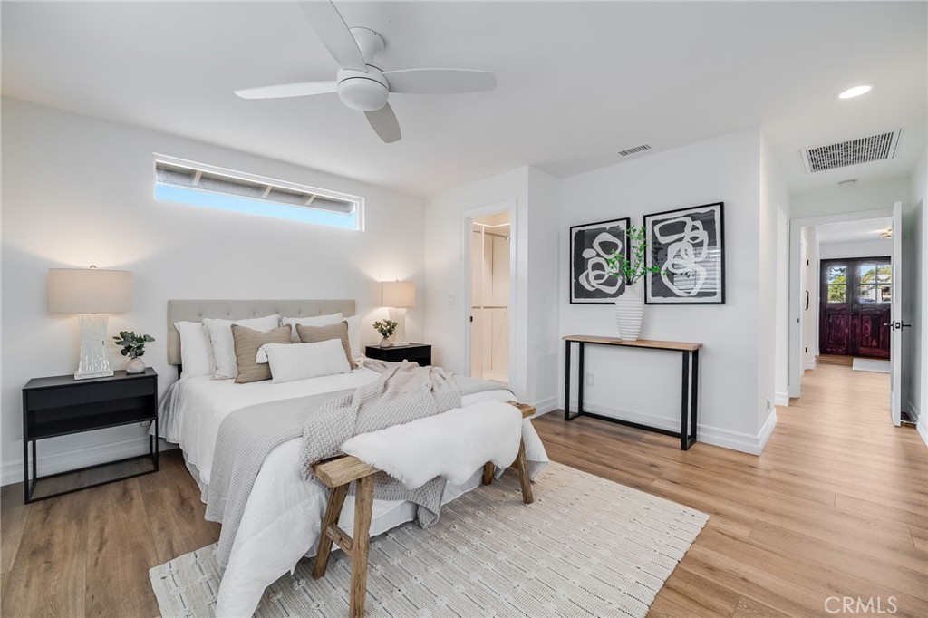 26822 Calle Real Dana Point, CA 92624 - Photo 17 of 41 a bedroom with a bed and a chandelier