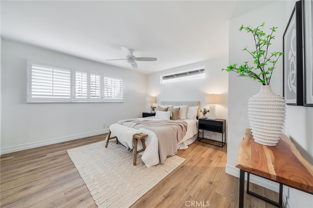 26822 Calle Real Dana Point, CA 92624 - Photo 18 of 41 a spacious bedroom with a bed and a potted plant
