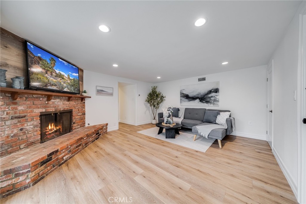 26822 Calle Real Dana Point, CA 92624 - Photo 25 of 41 a living room with furniture and a fireplace