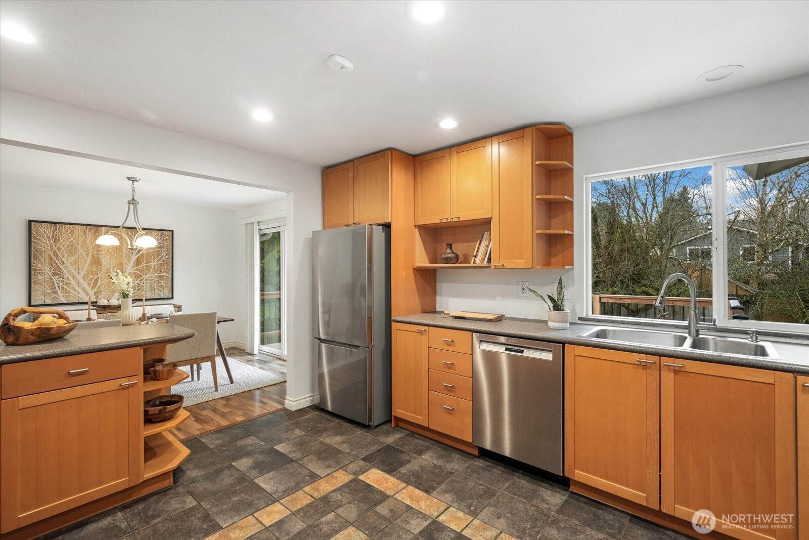 20702 11th Drive Southeast Bothell, WA 98012 - Photo 14 of 38 a kitchen with stainless steel appliances granite countertop a refrigerator a sink a stove and white cabinets