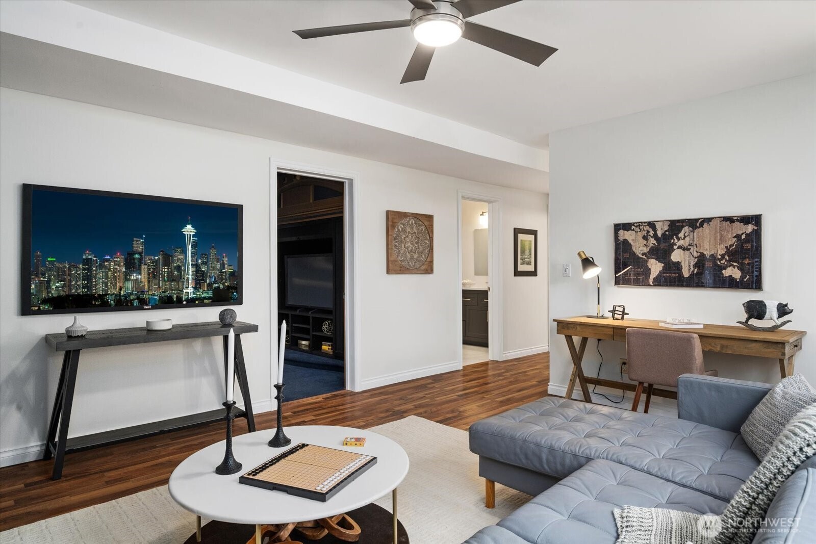 20702 11th Drive Southeast Bothell, WA 98012 - Photo 27 of 38 a living room with furniture and a chandelier
