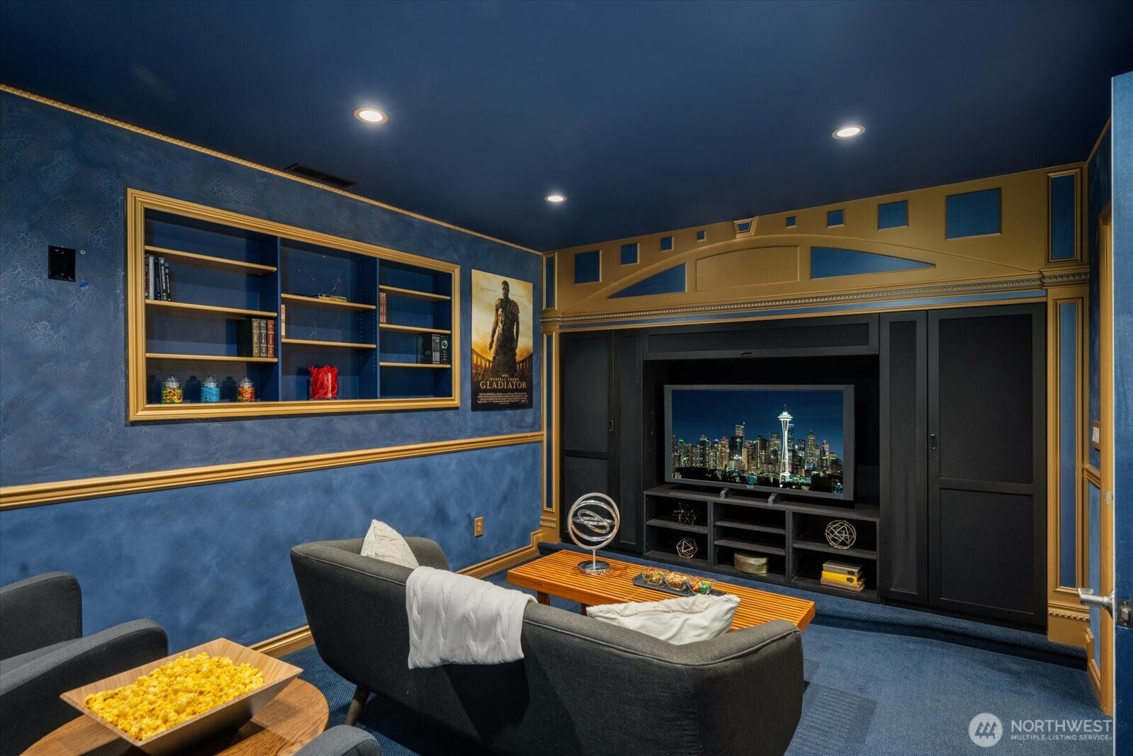 20702 11th Drive Southeast Bothell, WA 98012 - Photo 29 of 38 a living room with furniture a flat screen tv and a fireplace