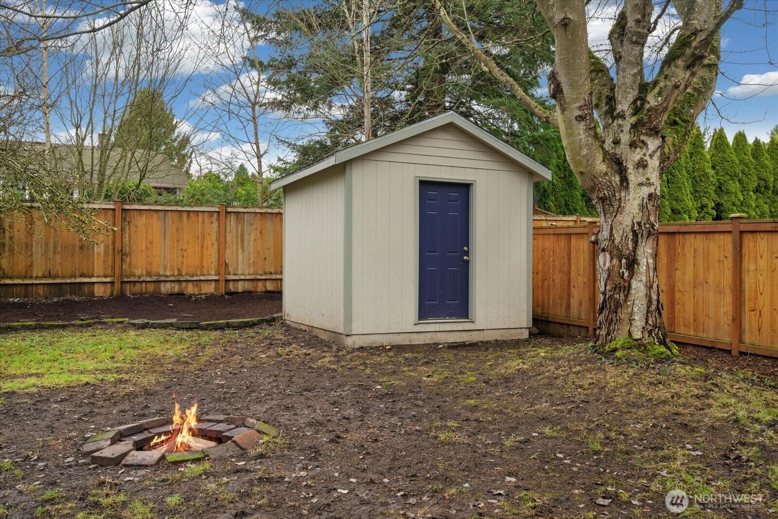 20702 11th Drive Southeast Bothell, WA 98012 - Photo 36 of 38 a view of a backyard with a small cabin and a chair