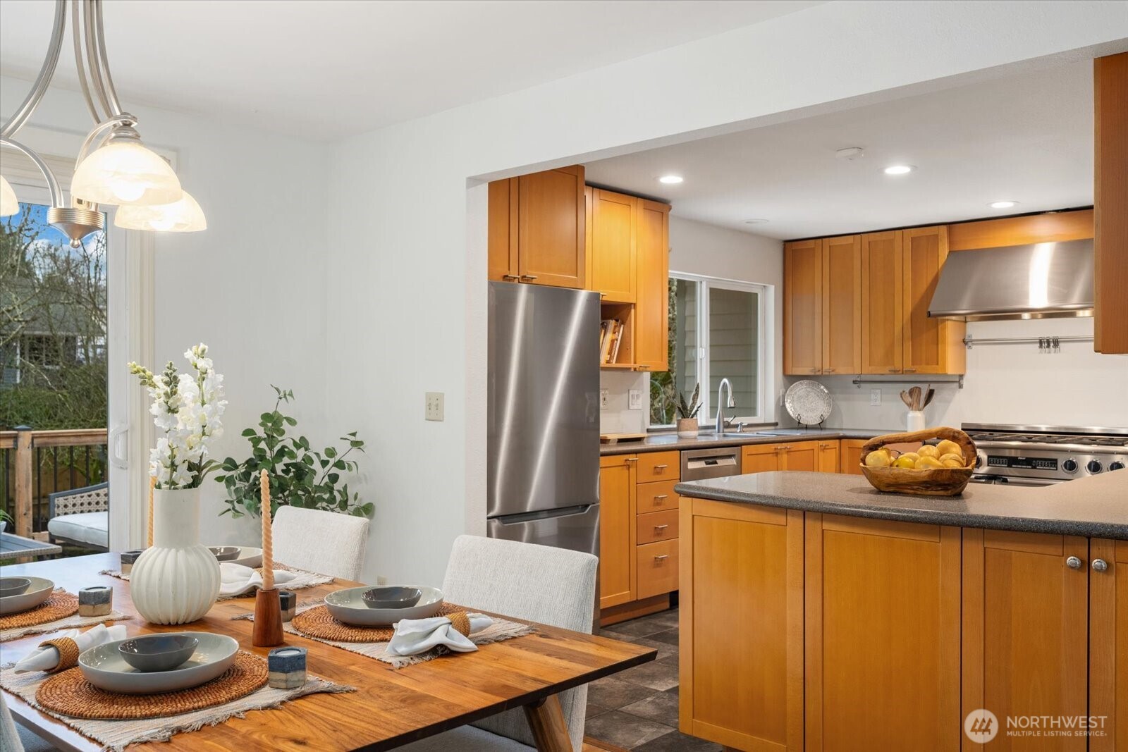 20702 11th Drive Southeast Bothell, WA 98012 - Photo 10 of 38 a kitchen with stainless steel appliances granite countertop sink stove refrigerator and cabinets