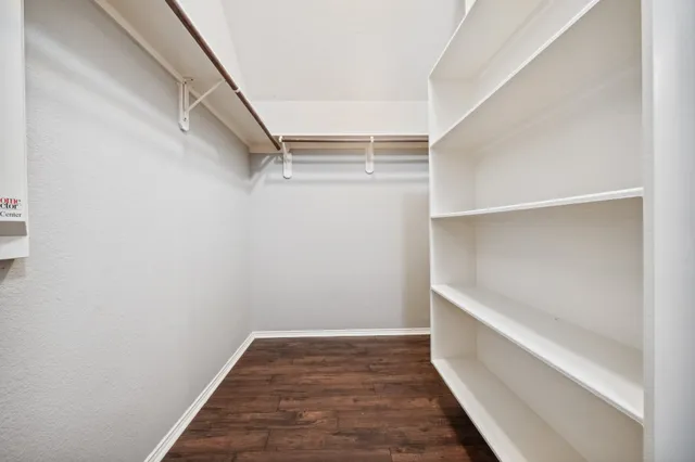 a view of an empty walk in closet