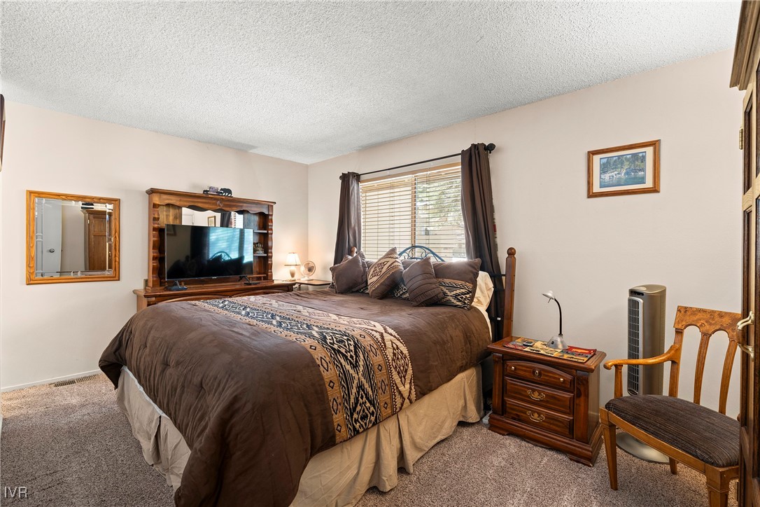 321 Ski Way, Unit 24 Incline Village, NV 89451 - Photo 10 of 31 a bedroom with a bed and a television