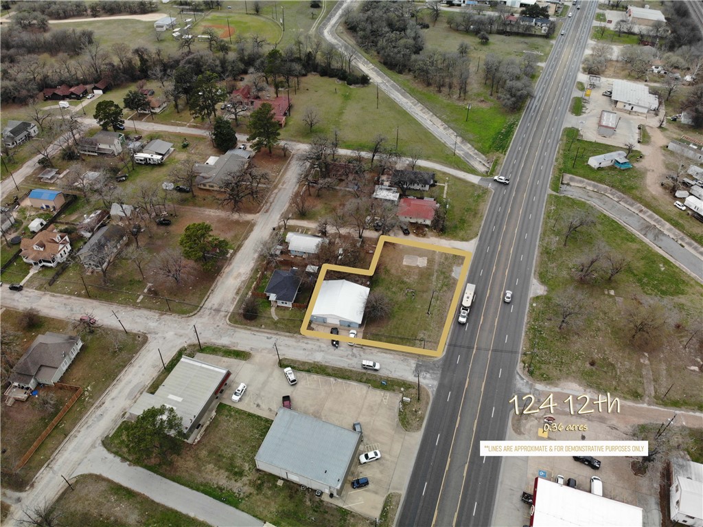 an aerial view of residential house with outdoor space