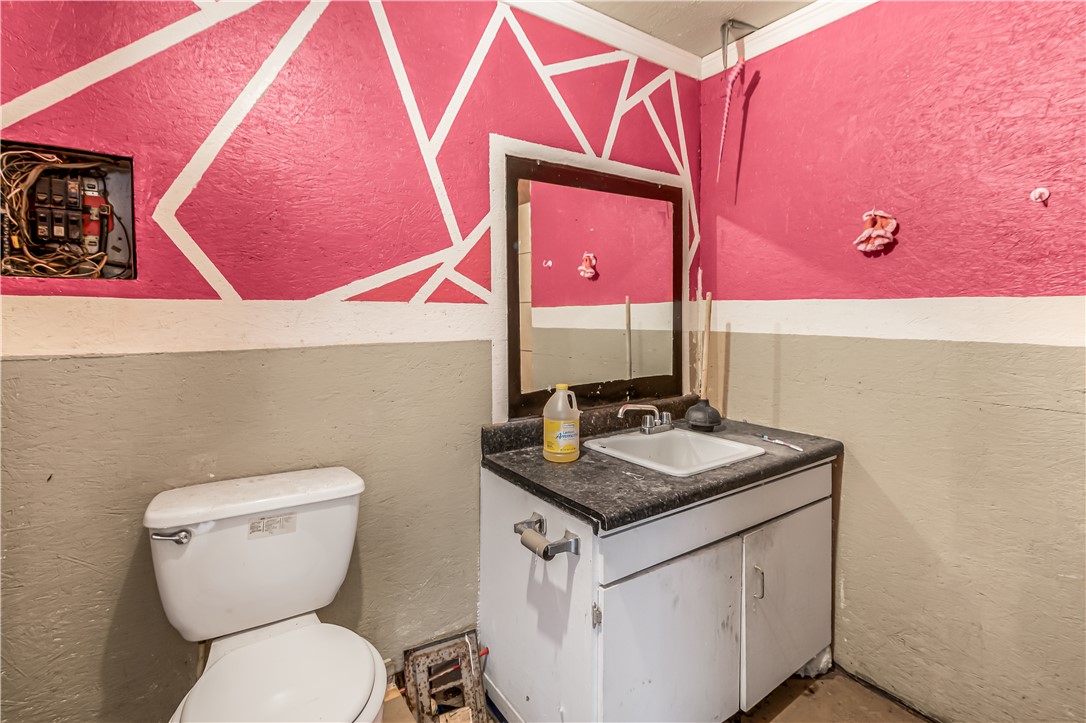 124 12th Street Somerville, TX 77879 - Photo 30 of 42 a bathroom with a sink and a toilet