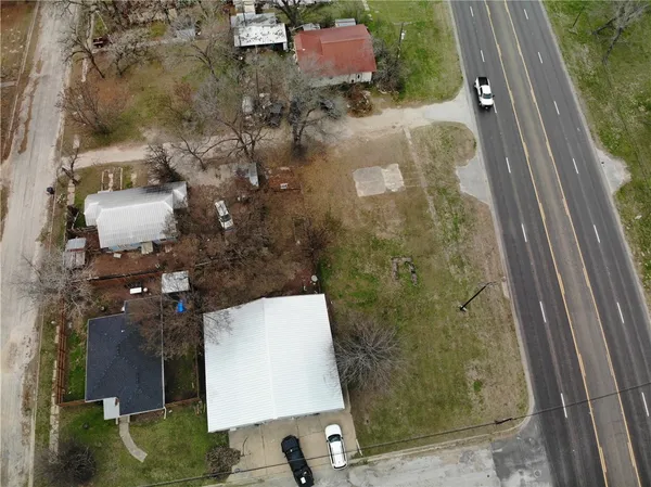 an aerial view of residential house with outdoor space