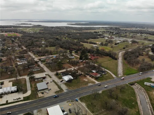 an aerial view of residential houses with city view