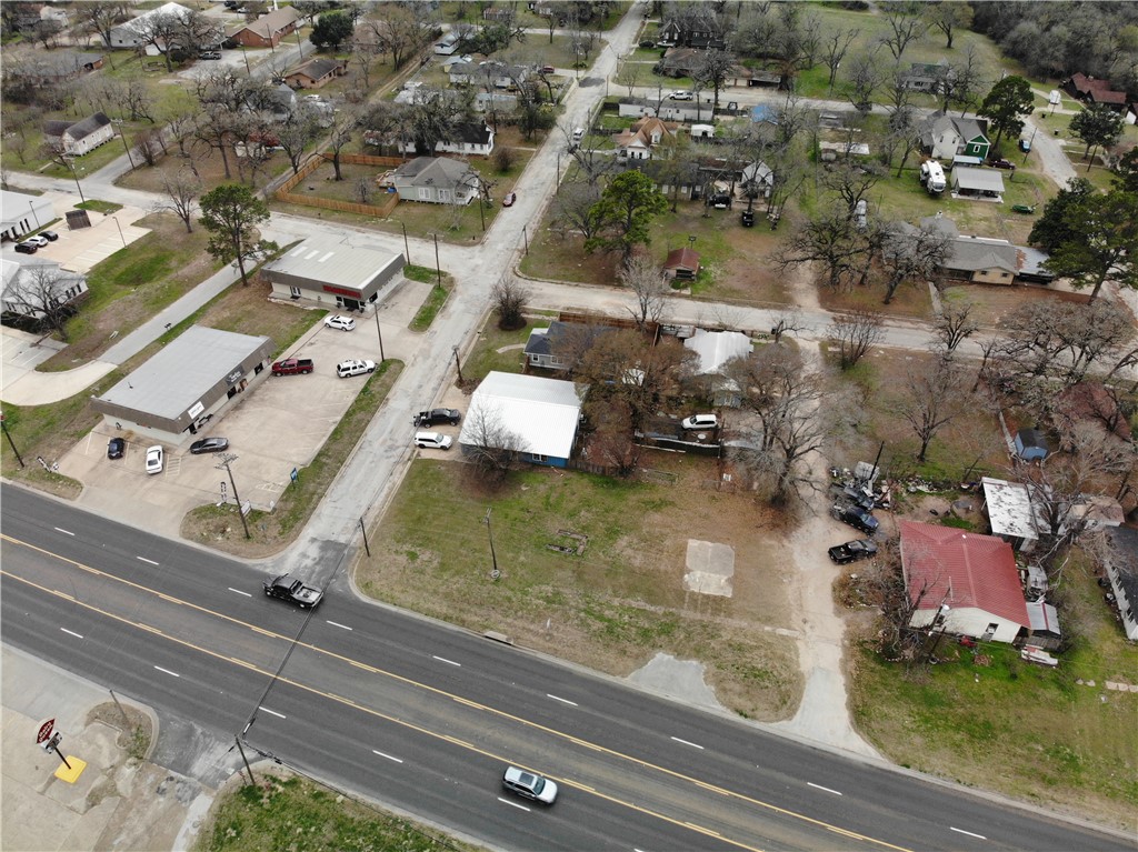 124 12th Street Somerville, TX 77879 - Photo 42 of 42 an aerial view of residential houses with outdoor space