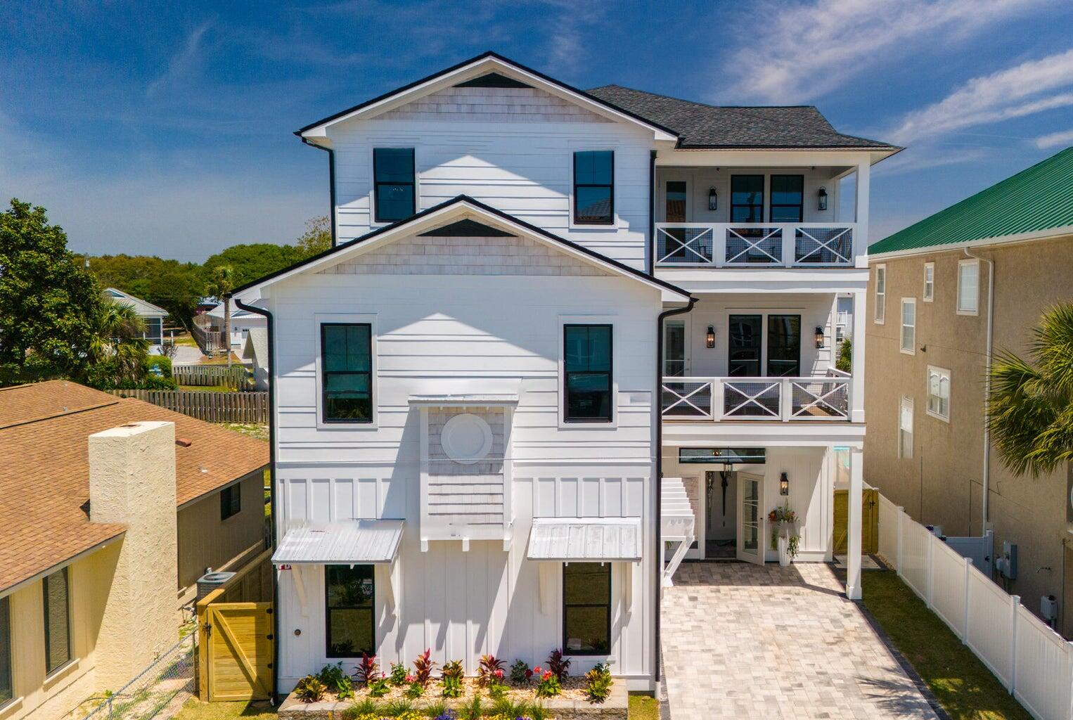 21524 Front Beach Road Panama City Beach, FL 32413 - Photo 2 of 73 a front view of a house with a yard