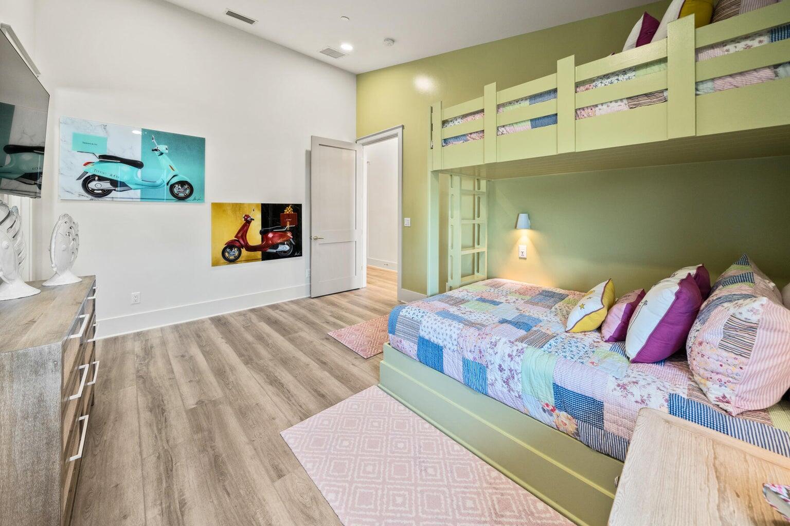 21524 Front Beach Road Panama City Beach, FL 32413 - Photo 25 of 73 a bedroom with a bed and a flat screen tv