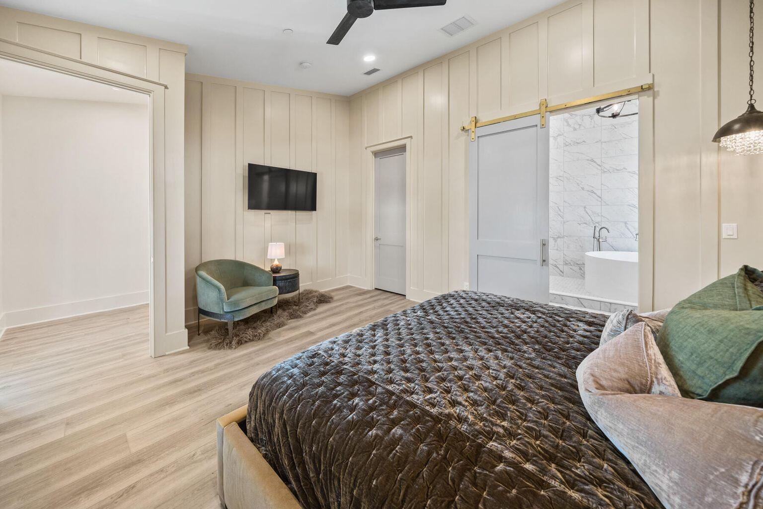 21524 Front Beach Road Panama City Beach, FL 32413 - Photo 34 of 73 a bedroom with bed and a couch