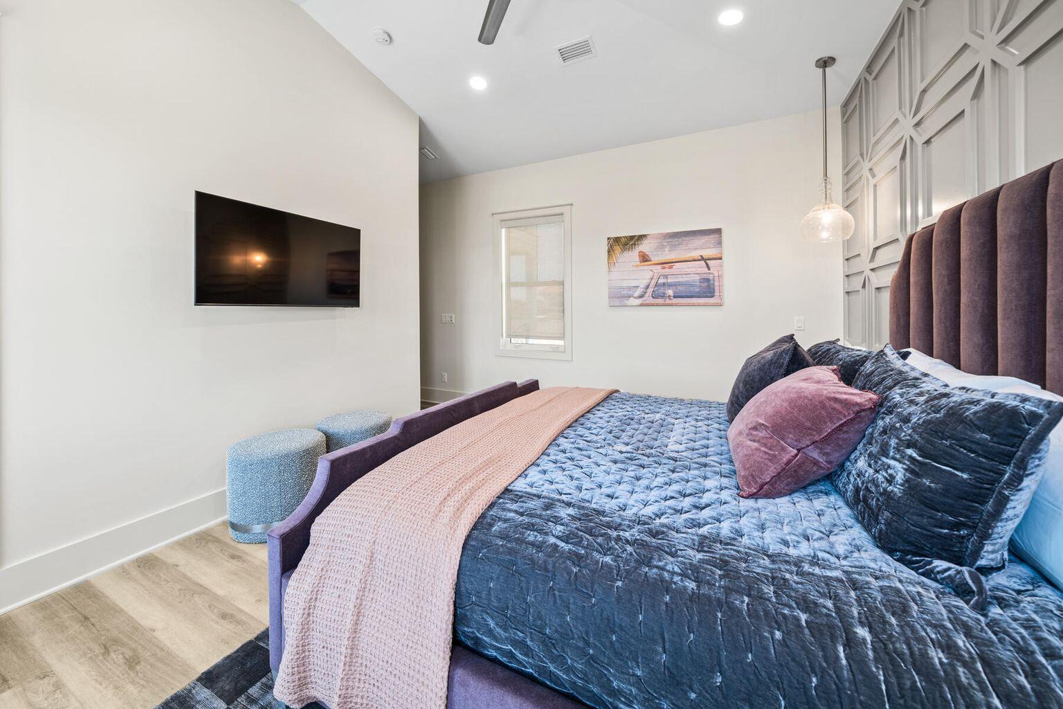 21524 Front Beach Road Panama City Beach, FL 32413 - Photo 44 of 73 a bedroom with a bed and a flat screen tv