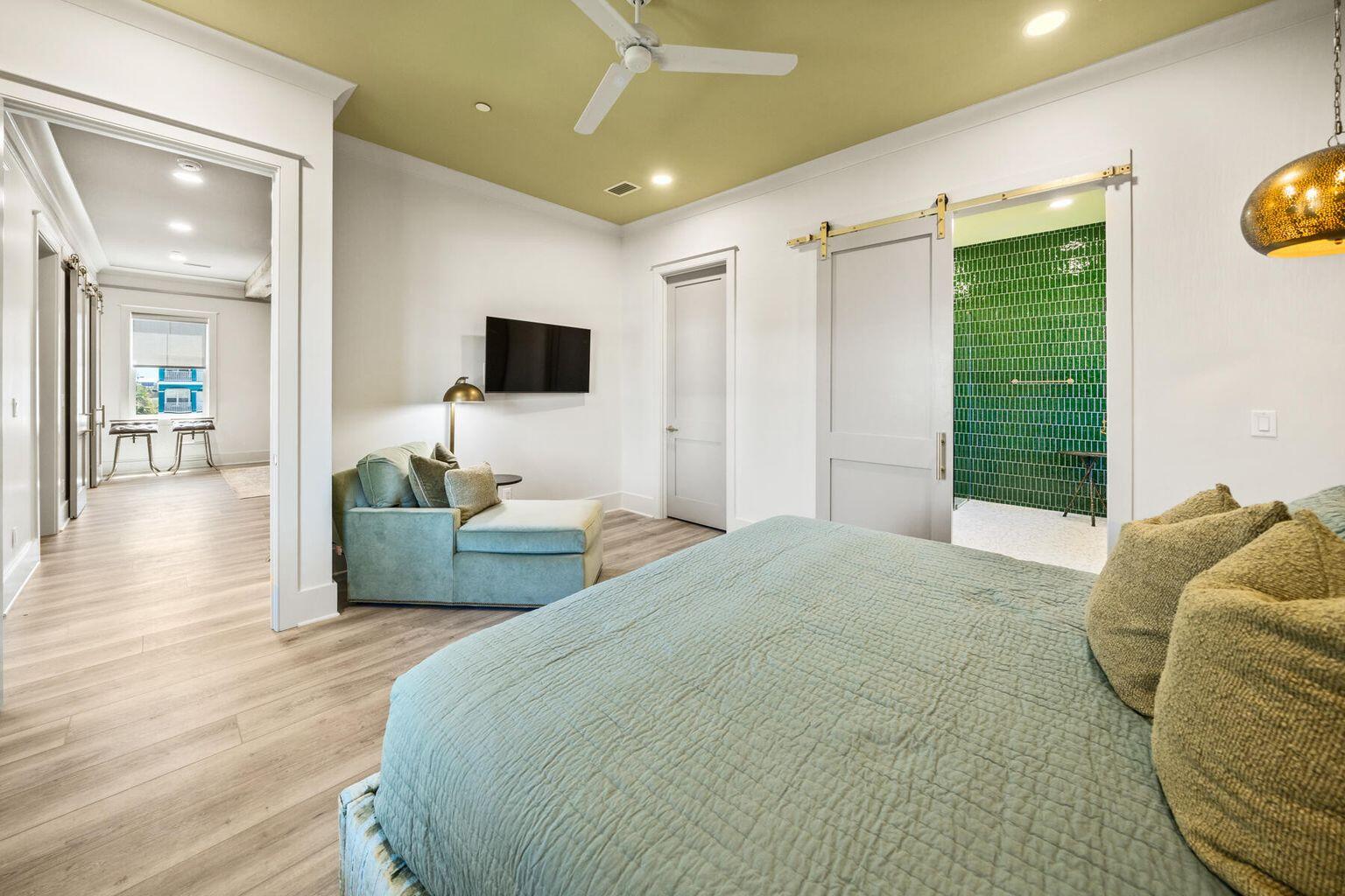 21524 Front Beach Road Panama City Beach, FL 32413 - Photo 47 of 73 a bedroom with a bed and a flat screen tv