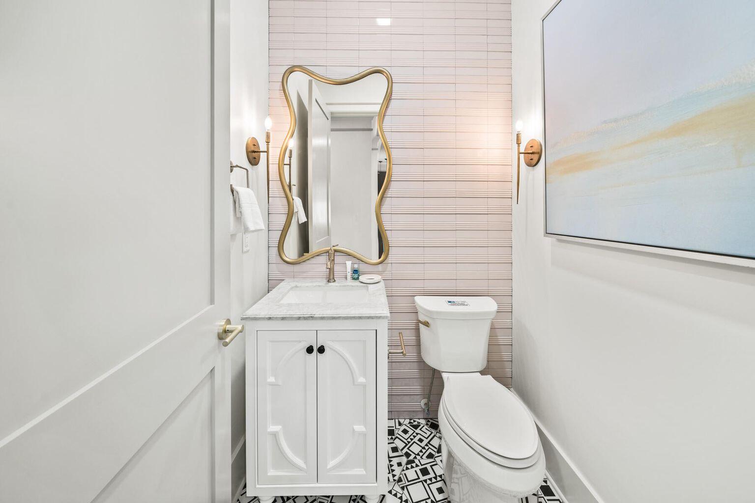 21524 Front Beach Road Panama City Beach, FL 32413 - Photo 49 of 73 a bathroom with a toilet sink and mirror