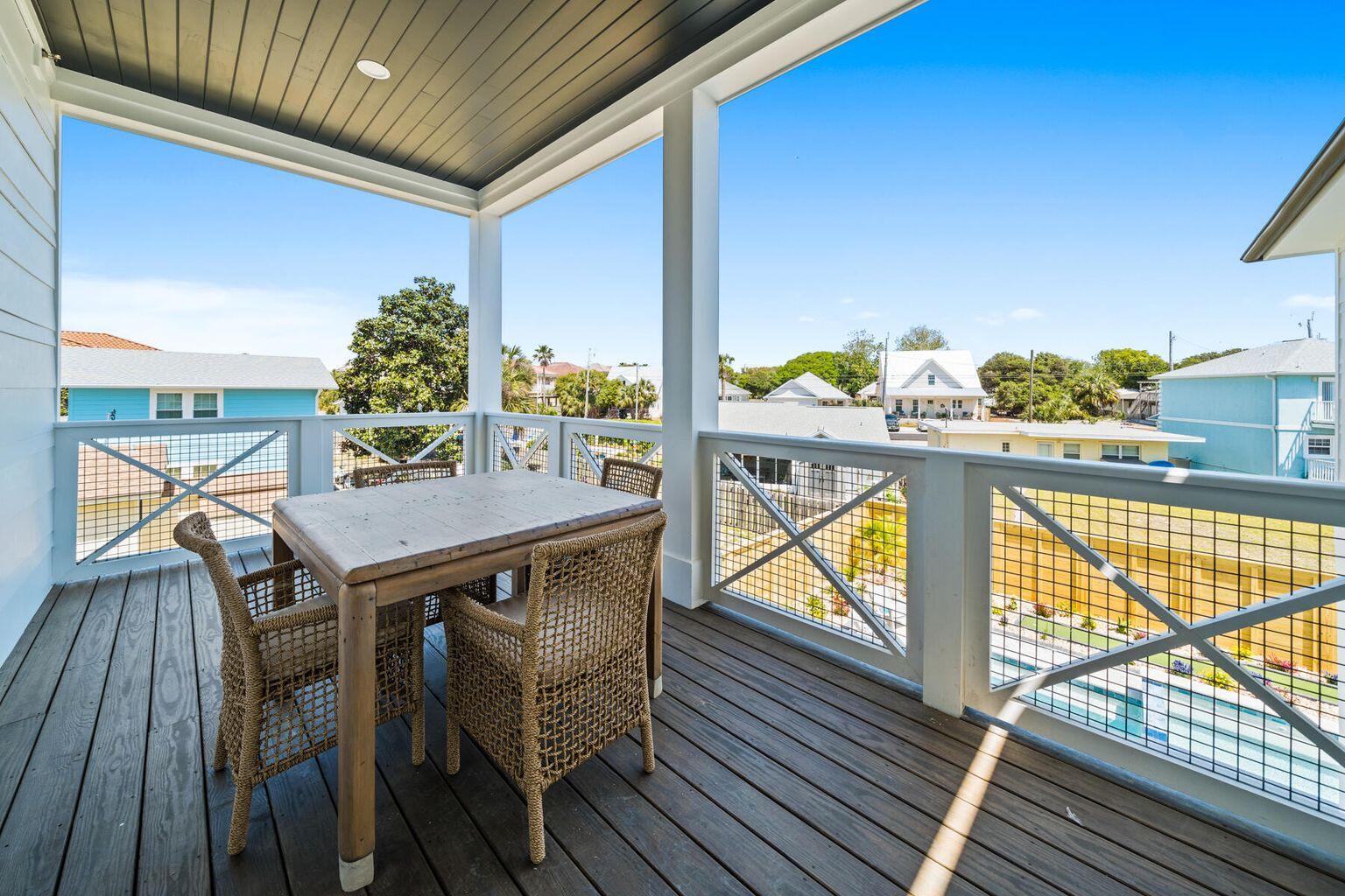 21524 Front Beach Road Panama City Beach, FL 32413 - Photo 52 of 73 a view of balcony with wooden floor and outdoor seating