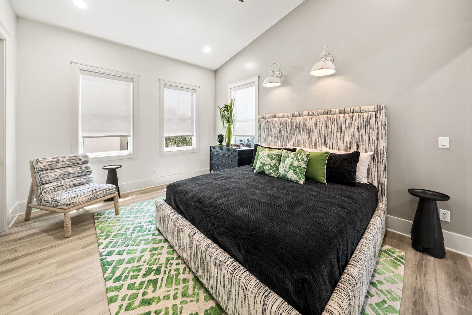 21524 Front Beach Road Panama City Beach, FL 32413 - Photo 56 of 73 a bedroom with a bed and wooden floor