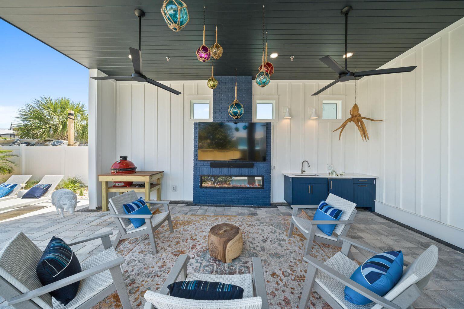 21524 Front Beach Road Panama City Beach, FL 32413 - Photo 65 of 73 a living room with furniture and a flat screen tv