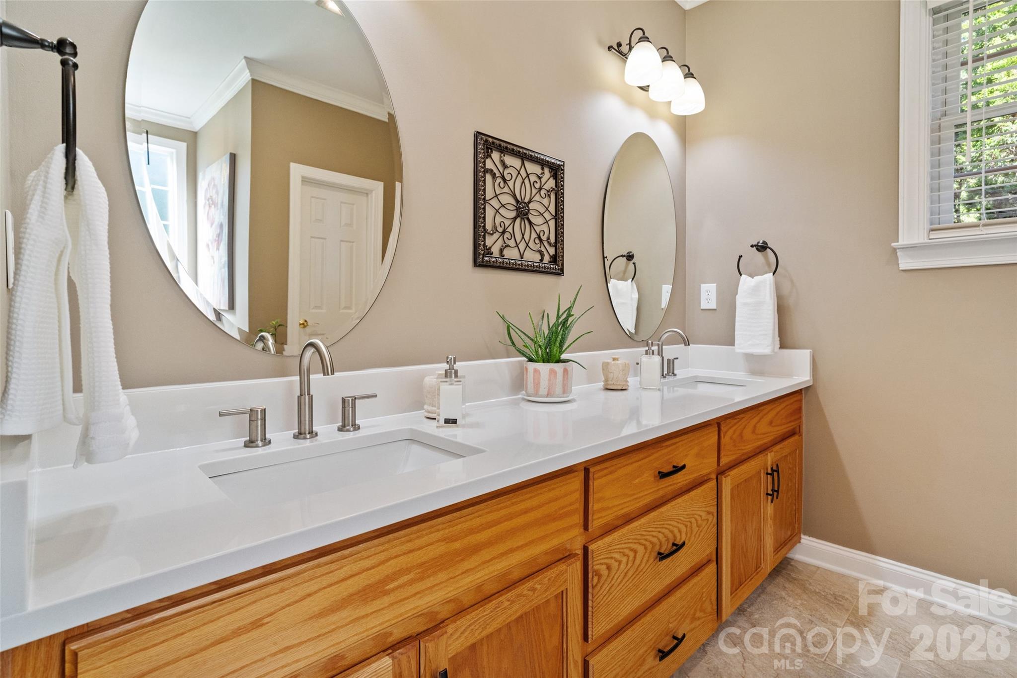1701 South Point Road Belmont, NC 28012 - Photo 13 of 44 a bathroom with a double vanity sink and a mirror