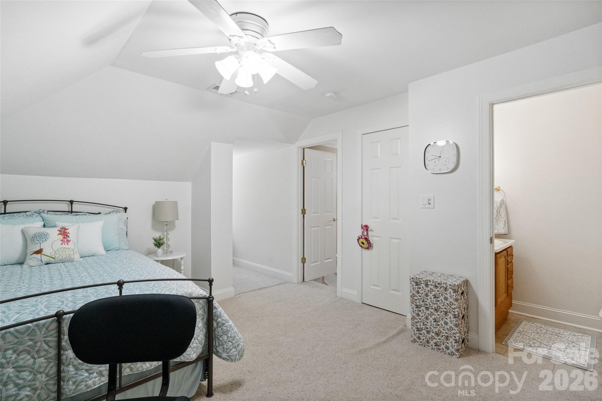 1701 South Point Road Belmont, NC 28012 - Photo 20 of 44 a bedroom with a bed and a chandelier