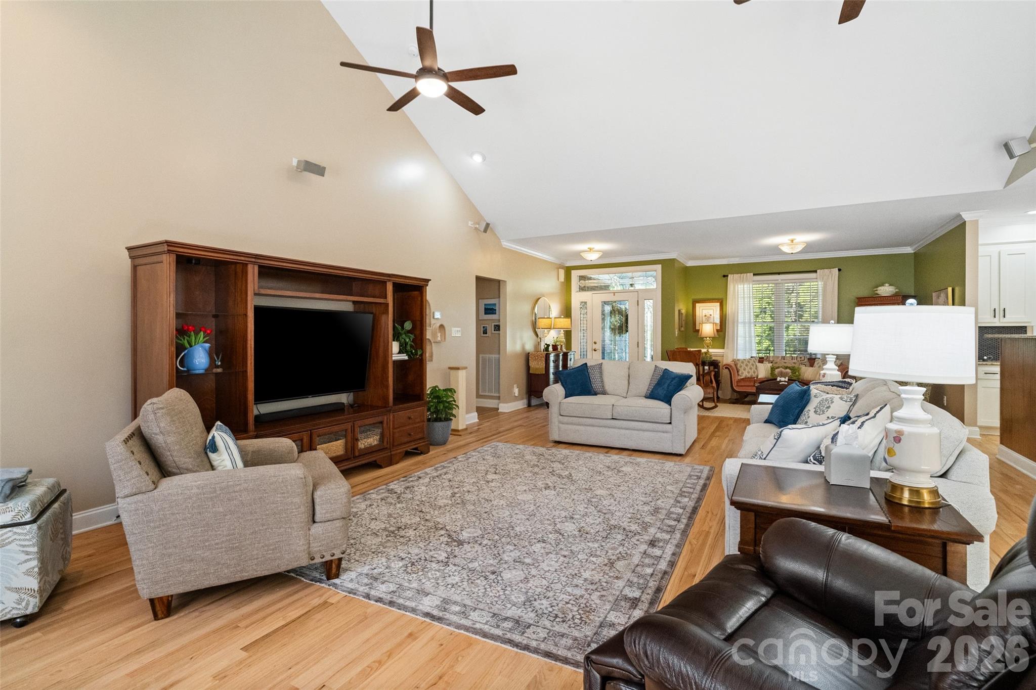 1701 South Point Road Belmont, NC 28012 - Photo 22 of 44 a living room with furniture and a flat screen tv