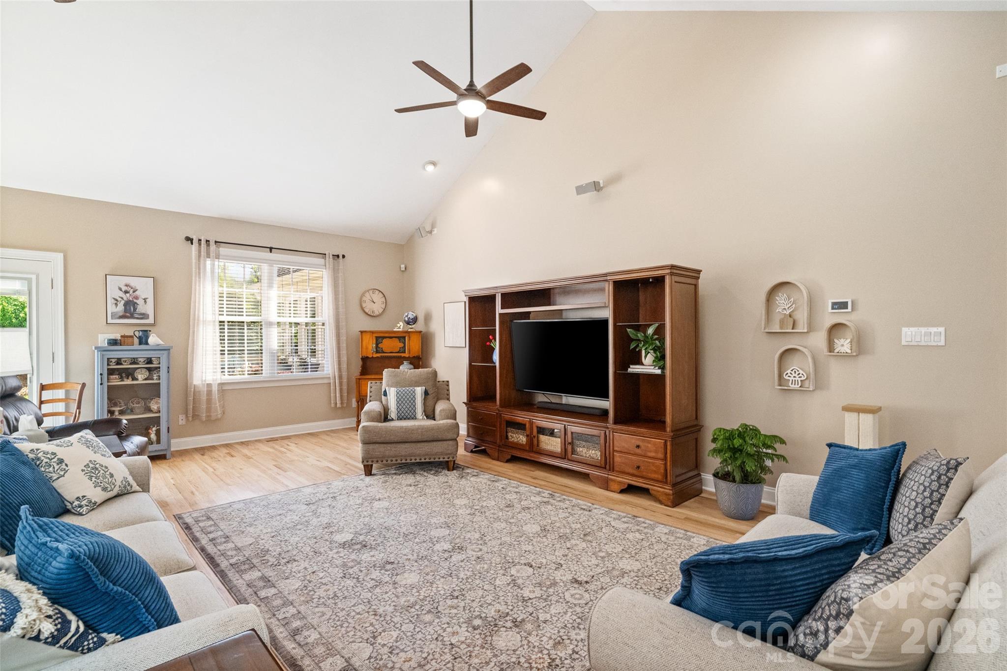 1701 South Point Road Belmont, NC 28012 - Photo 24 of 44 a living room with furniture and a flat screen tv