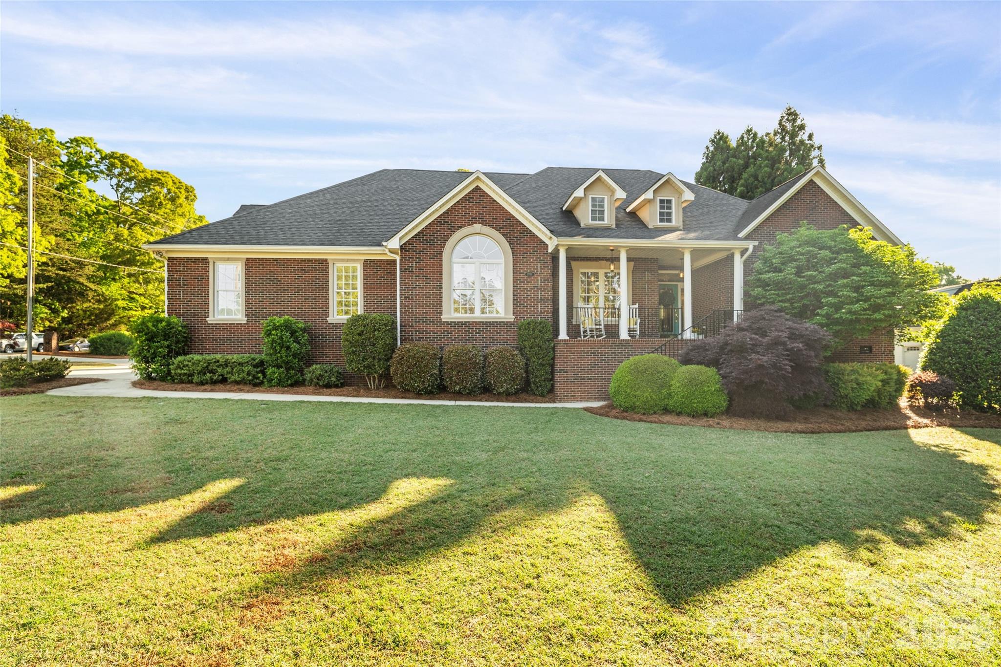 1701 South Point Road Belmont, NC 28012 - Photo 28 of 44 a front view of a house with a yard and garage