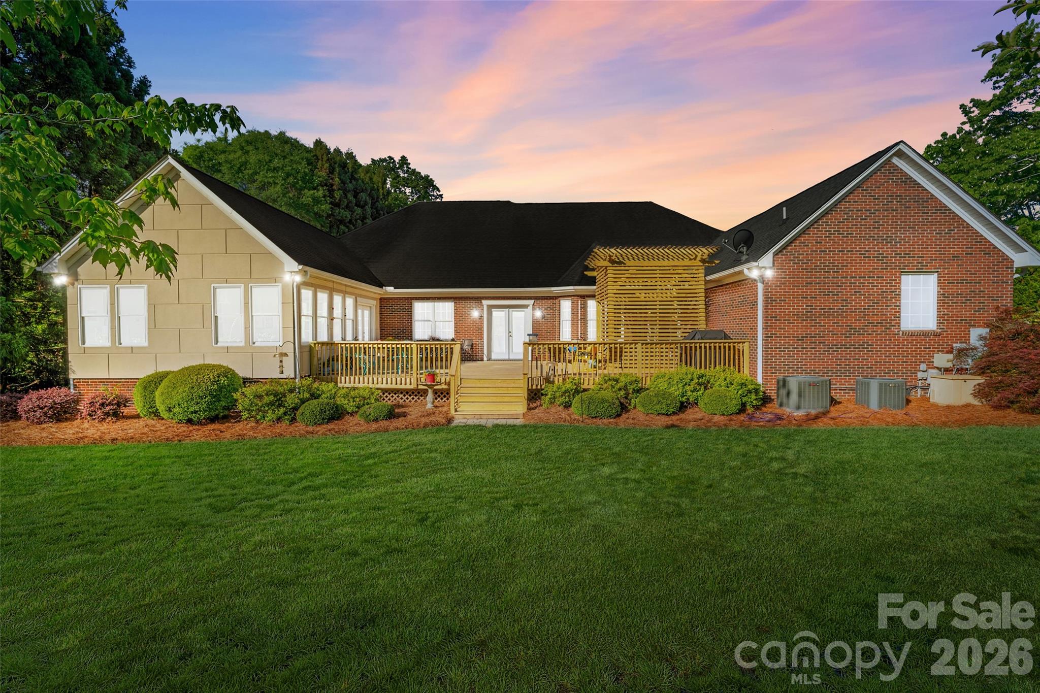 1701 South Point Road Belmont, NC 28012 - Photo 33 of 44 a front view of a house with garden