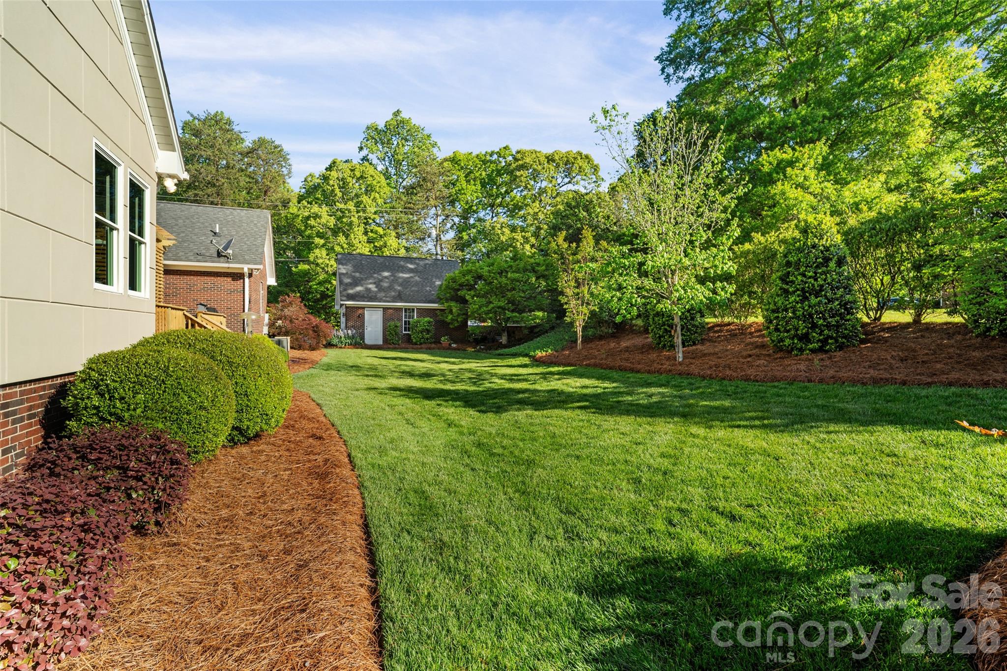1701 South Point Road Belmont, NC 28012 - Photo 36 of 44 a view of a garden with a house