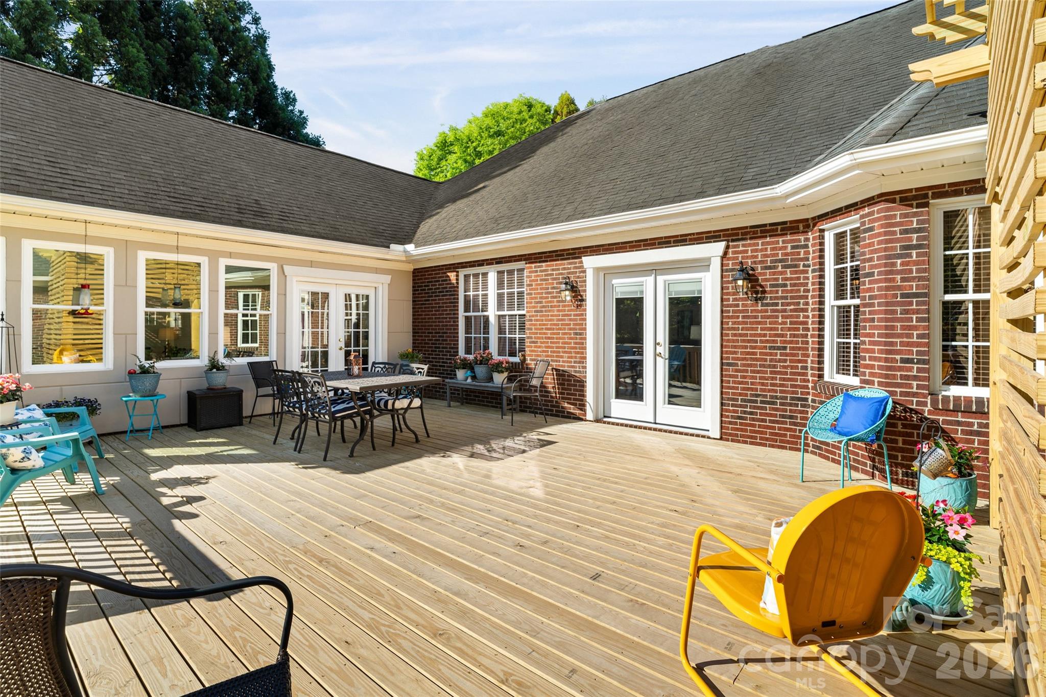 1701 South Point Road Belmont, NC 28012 - Photo 39 of 44 a view of a dinning table and chairs in patio of the house