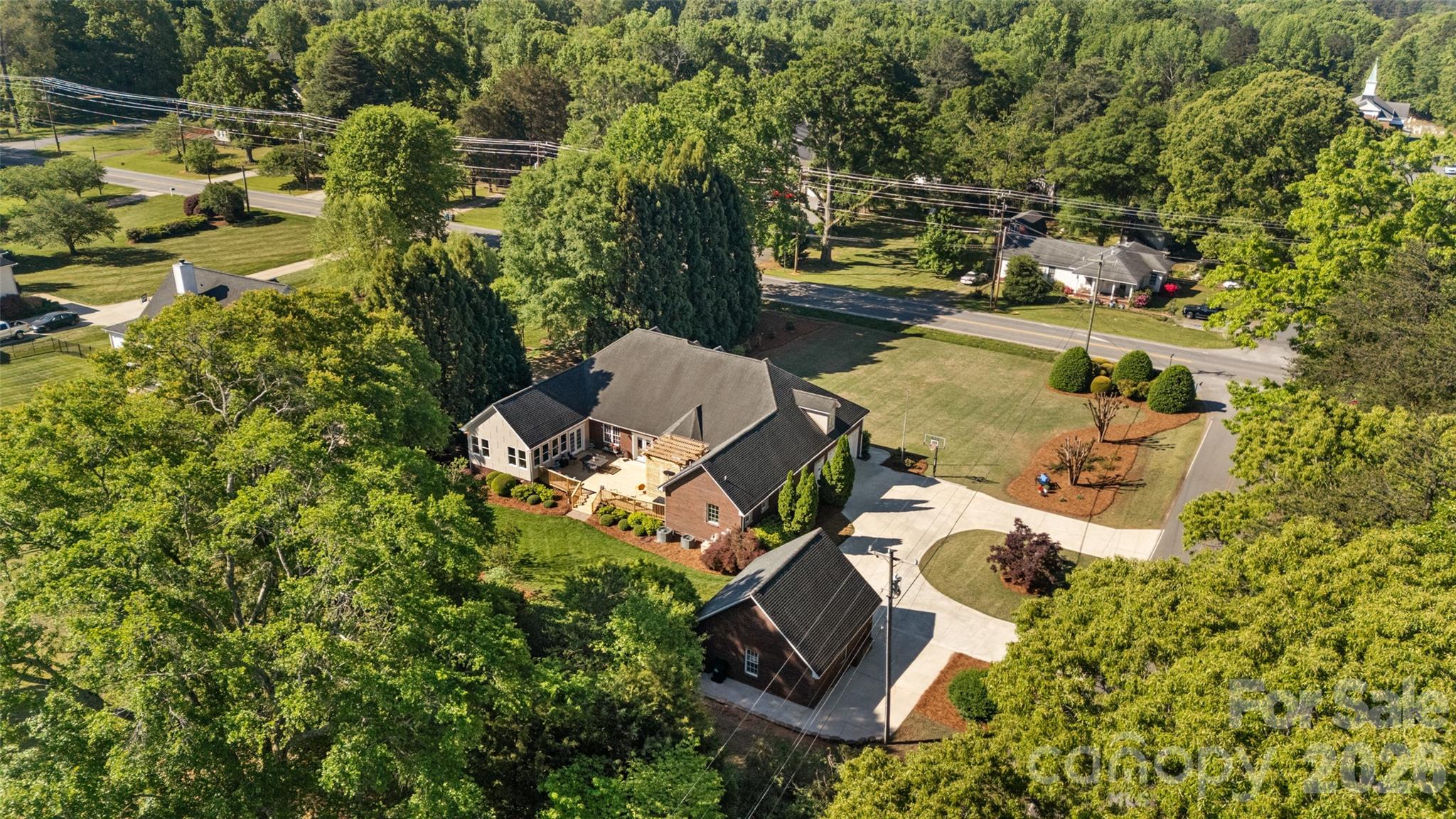 1701 South Point Road Belmont, NC 28012 - Photo 43 of 44 an aerial view of a house with swimming pool and outdoor space