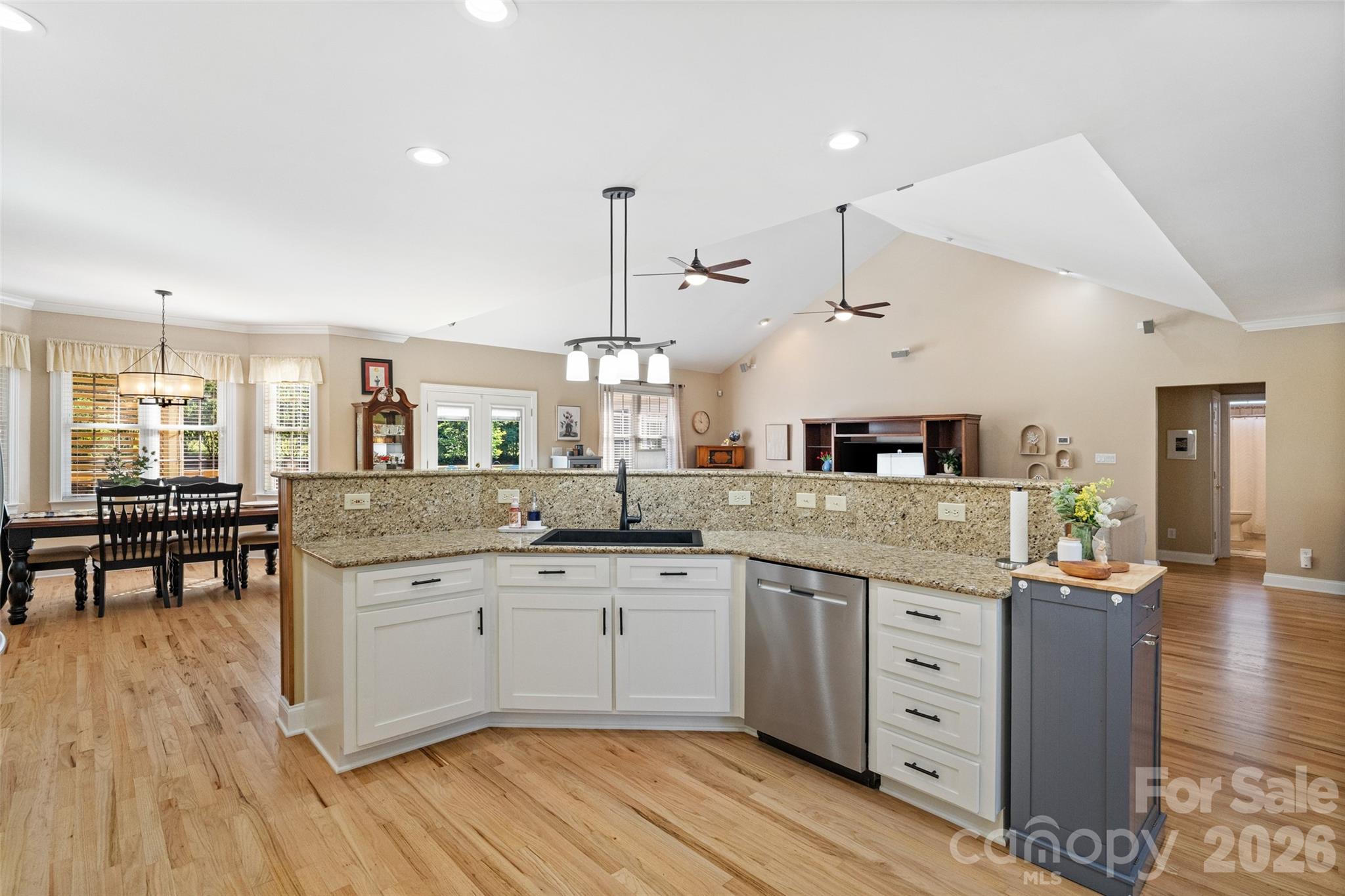 1701 South Point Road Belmont, NC 28012 - Photo 6 of 44 a large kitchen with cabinets and wooden floor