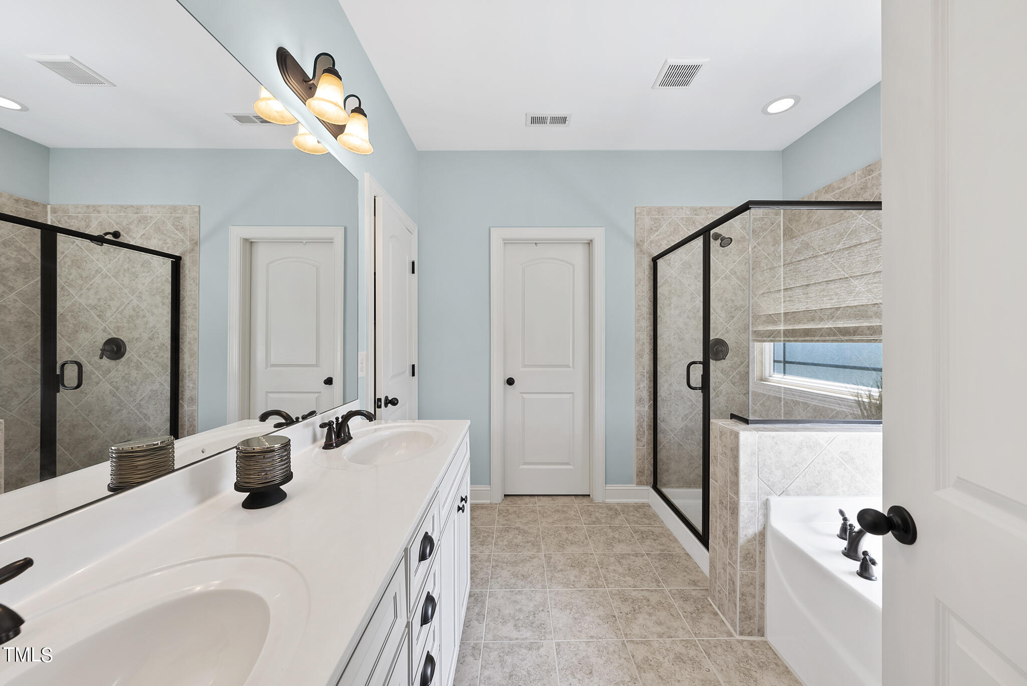1365 Formal Garden Way Raleigh, NC 27603 - Photo 16 of 39 Primary bathroom with dual vanities, water closet, and walk-in closet