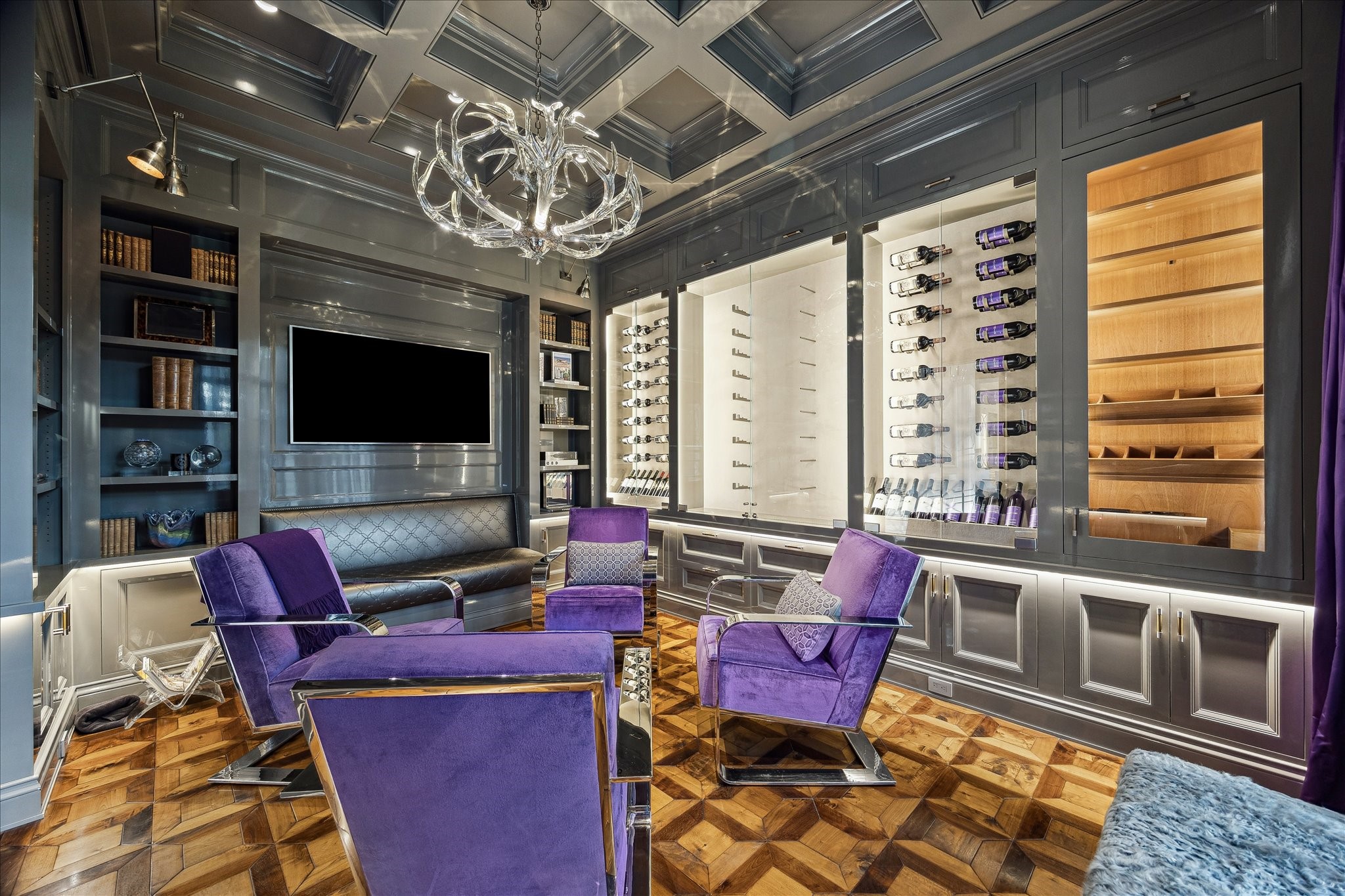 220 Merrie Way Lane Houston, TX 77024 - Photo 4 of 50 A tailored retreat, the lounge features custom-patterned oak floors, lacquered walls and ceilings, and a lucite antler chandelier. Thoughtful details include backlit wine and gun displays with suede lining, a built-in humidor with advanced air purification for cigars, and designer art lighting.