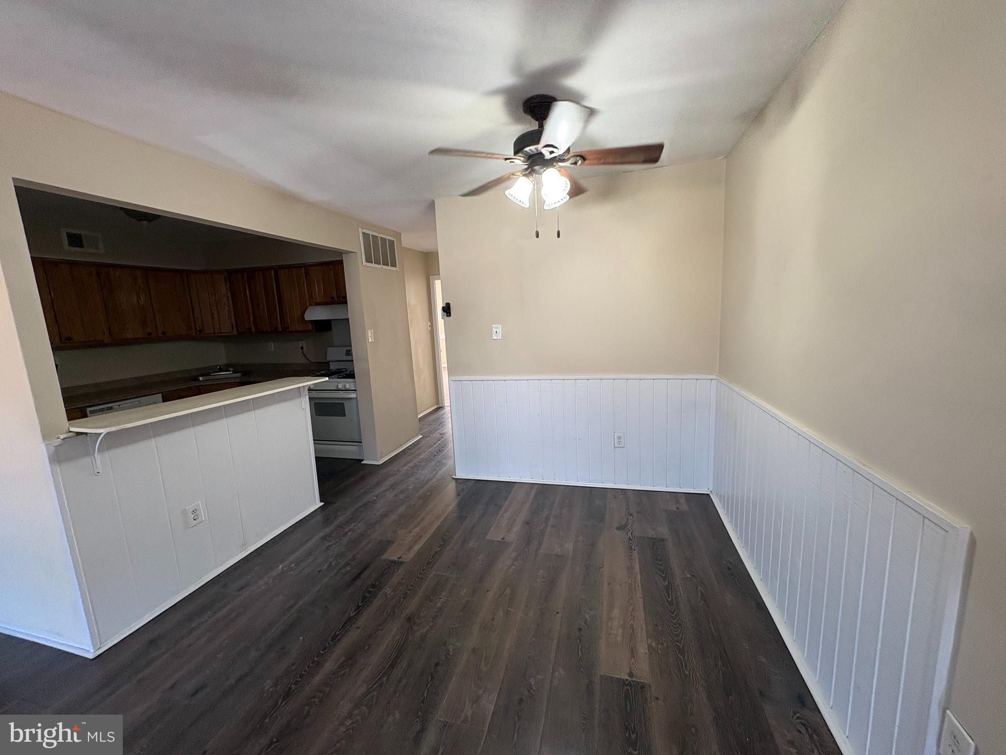 2840 Brighton Place, Unit 2 Philadelphia, PA 19149 - Photo 10 of 13 a view of a room with wooden floor and ceiling fan