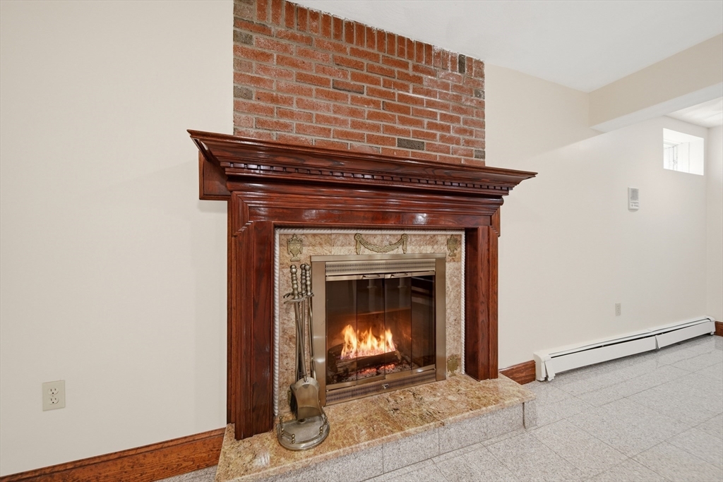 131 Range Heights Road Lynn, MA 01904 - Photo 27 of 36 a stove top oven sitting inside of a house