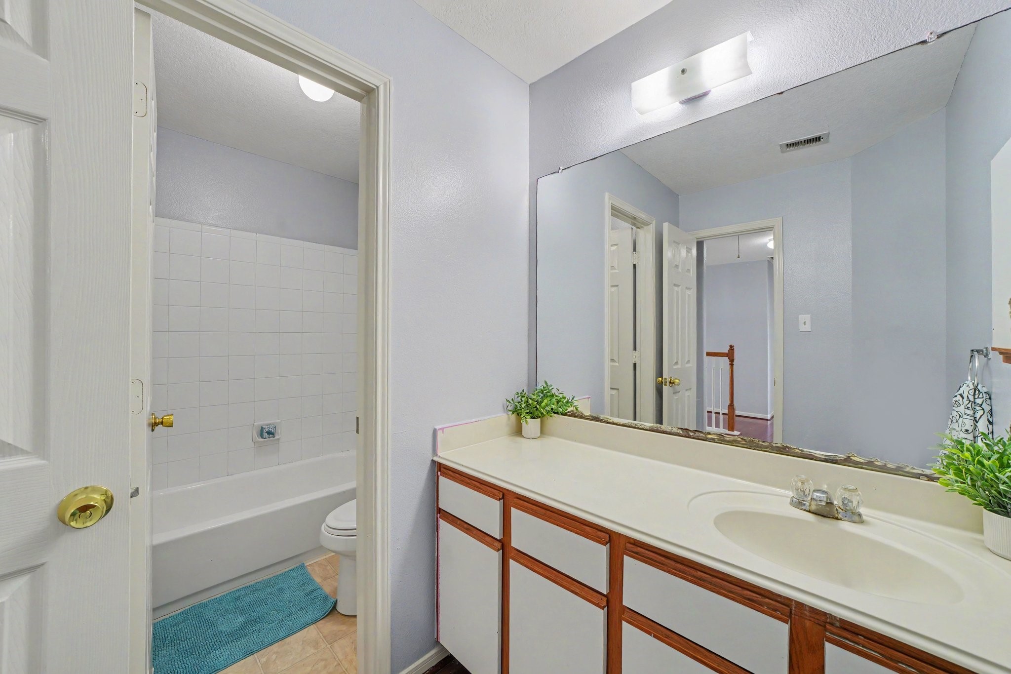 5622 Wasabi Lane Baytown, TX 77521 - Photo 23 of 29 a bathroom with a sink and a mirror