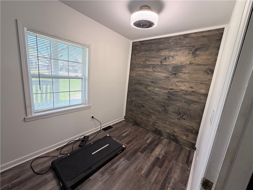 6800 Farmington Road Miamisburg, OH 45342 - Photo 12 of 32 This versatile room features a distinctive wood accent wall and durable flooring.